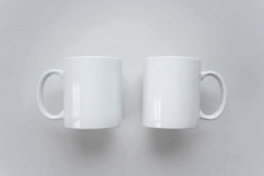 An assortment of branded promotional items grouped on a plain surface, the kind of mixed order a merchandise supplier fulfils from several different supplier ranges at once.